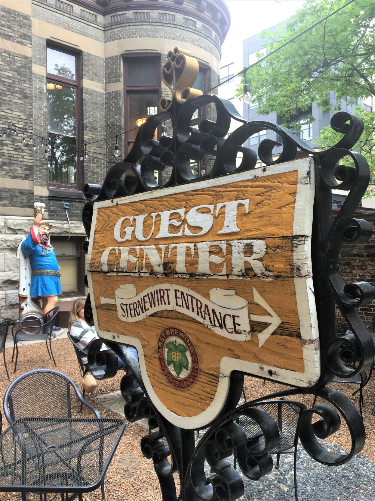 Sternewirt courtyard with Guest Center sign and King Gambrinus statue at Best Place, part of the historic Pabst Brewing Co. campus in downtown Milwaukee